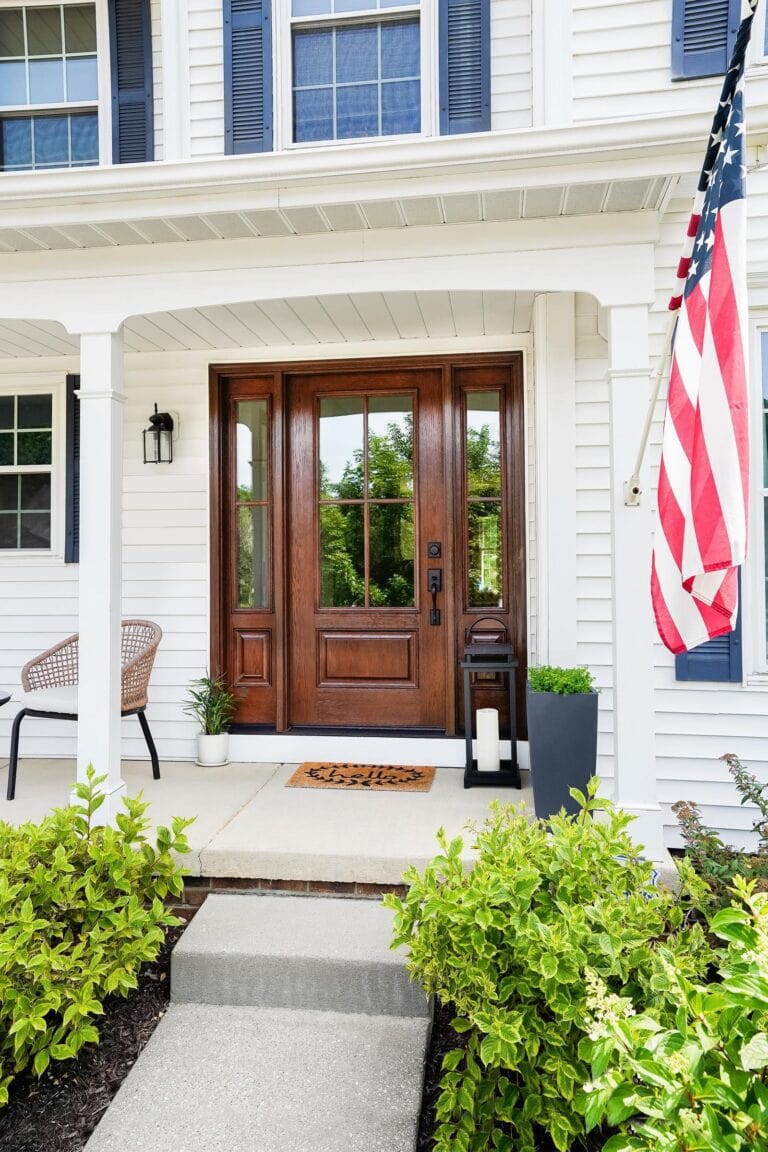 ProVia Signet fiberglass entry door with sidelites on a front porch