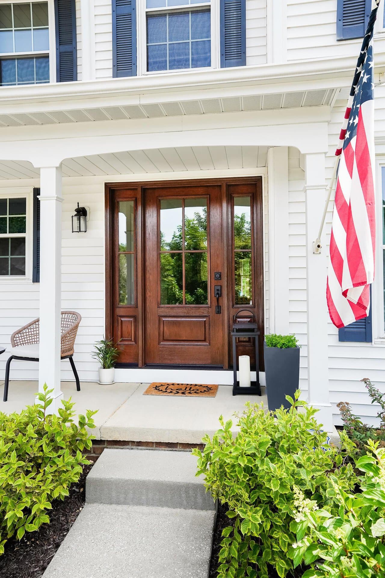 ProVia Signet fiberglass entry door with sidelites on a front porch