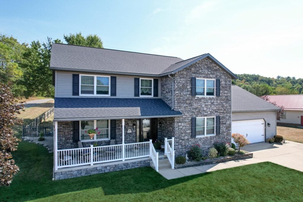 Two-story home with ProVia Aeris windows and Terra Cut stone