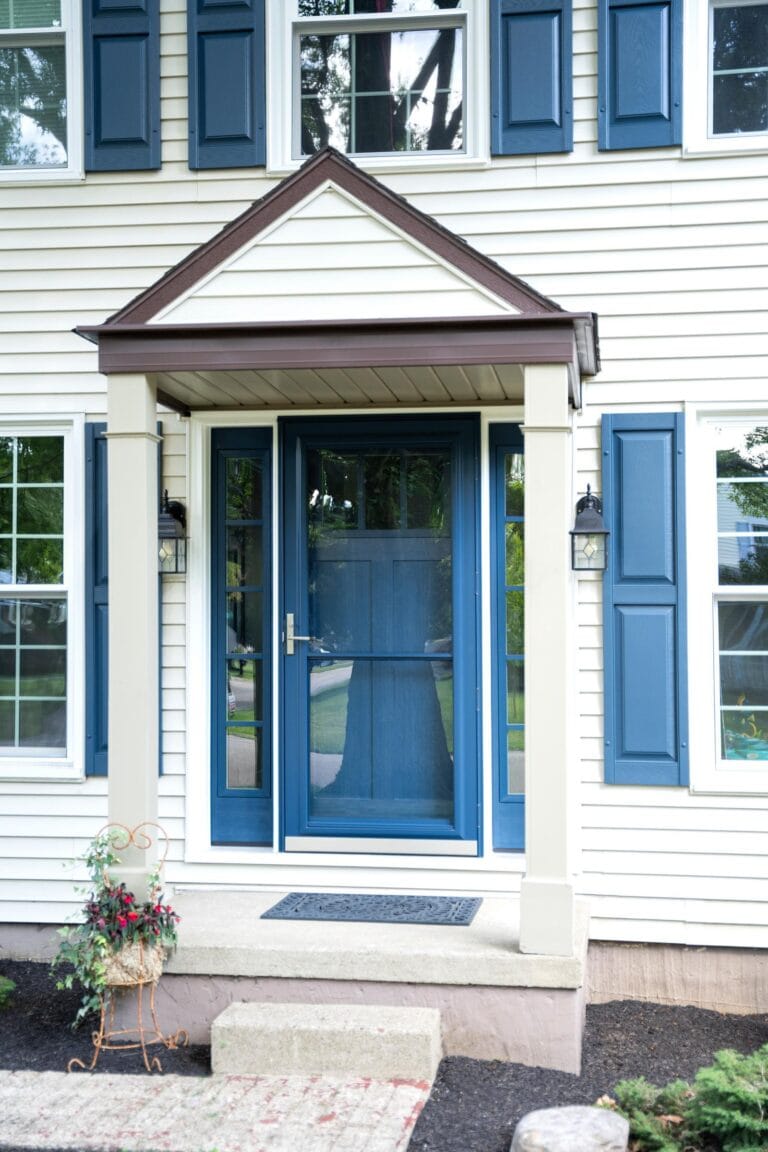 Blue entry door with a ProVia Spectrum full-view storm door